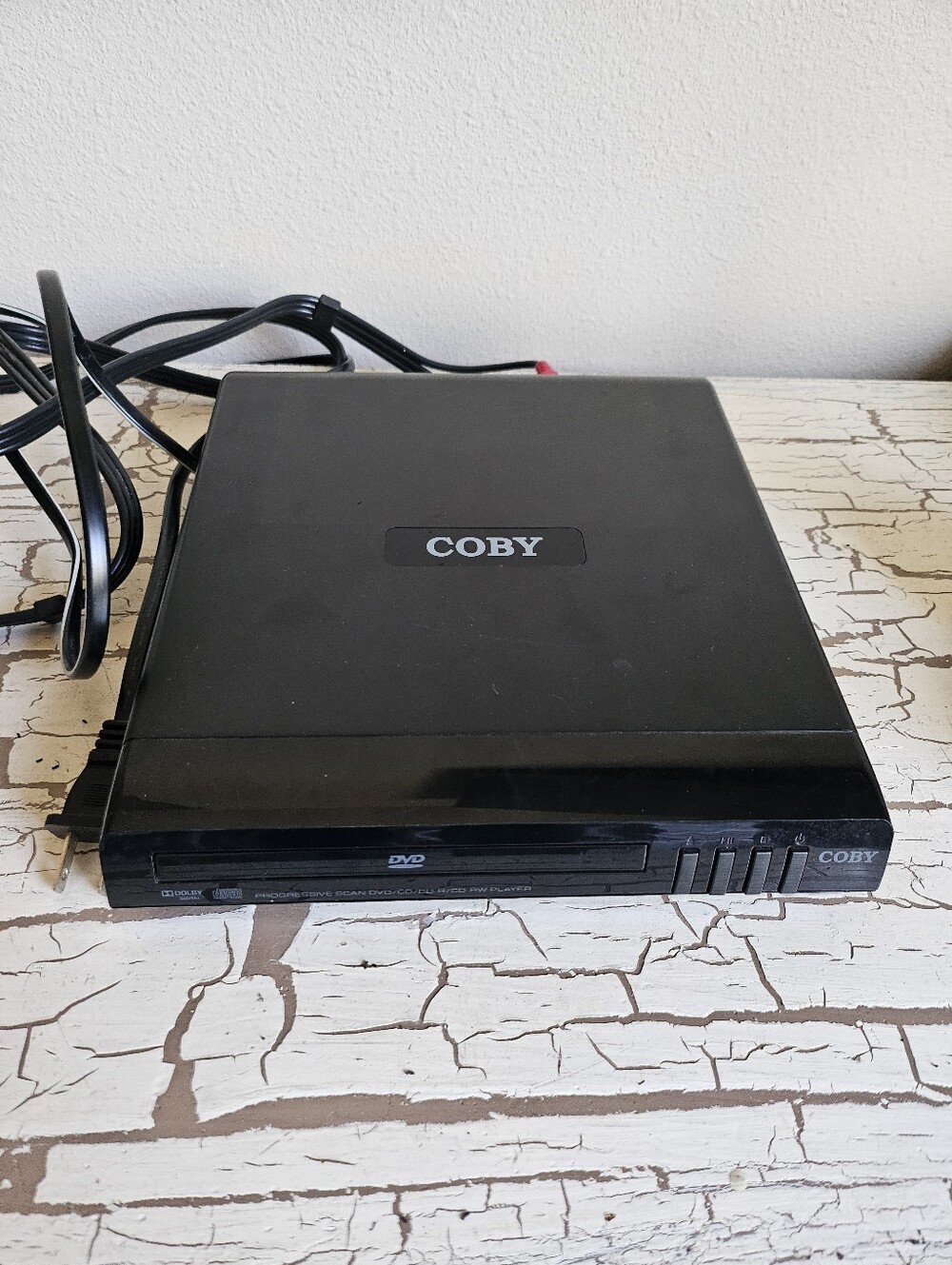 Black Coby Progressive Scan DVD Player, tested in good condition.